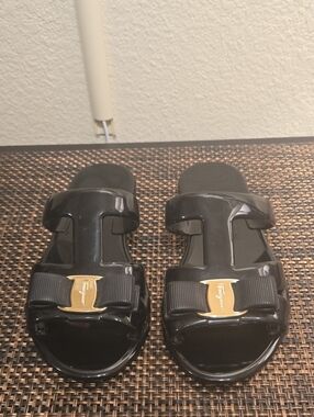 Salvatore Ferragamo Black Patent Bow Slide Sandals with Gold Accent
